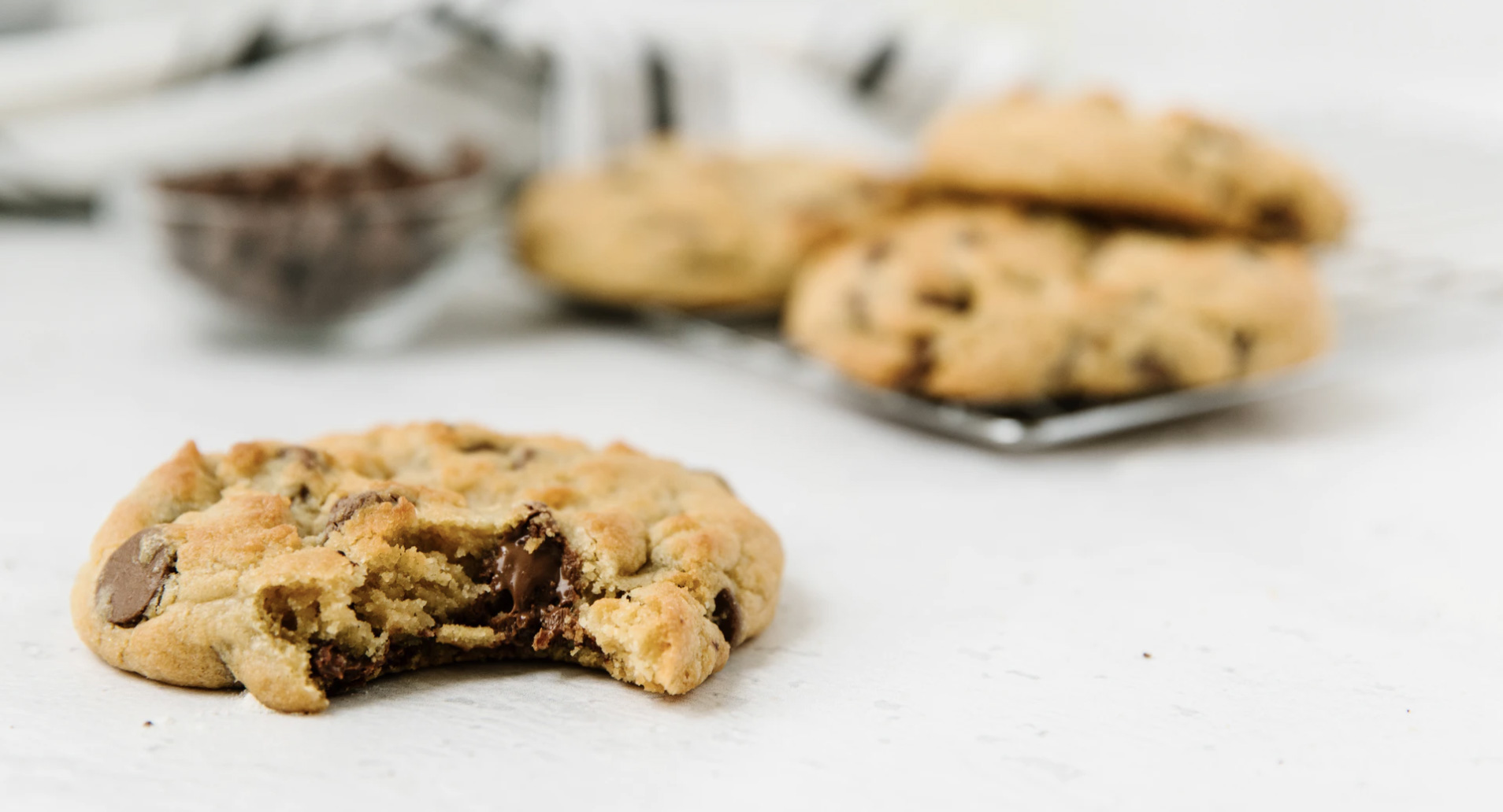 Chocolate chip cookie with a bite taken out of it 