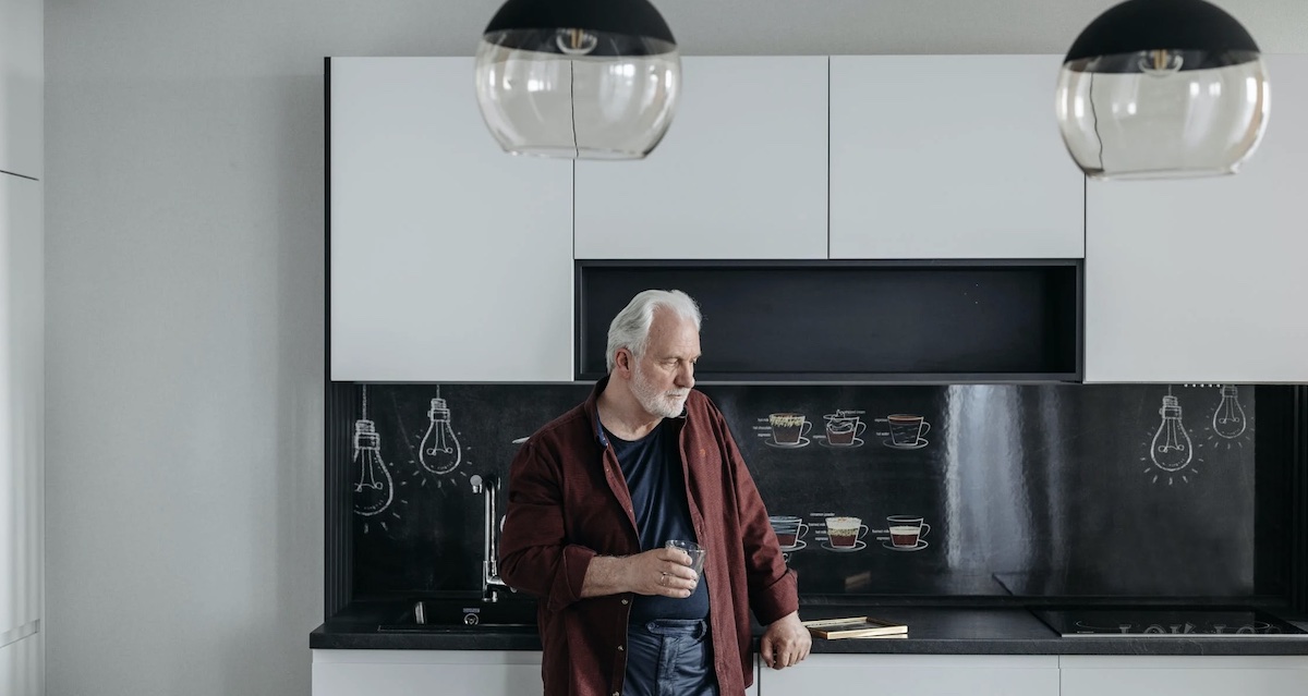 Lonely and sad man in kitchen