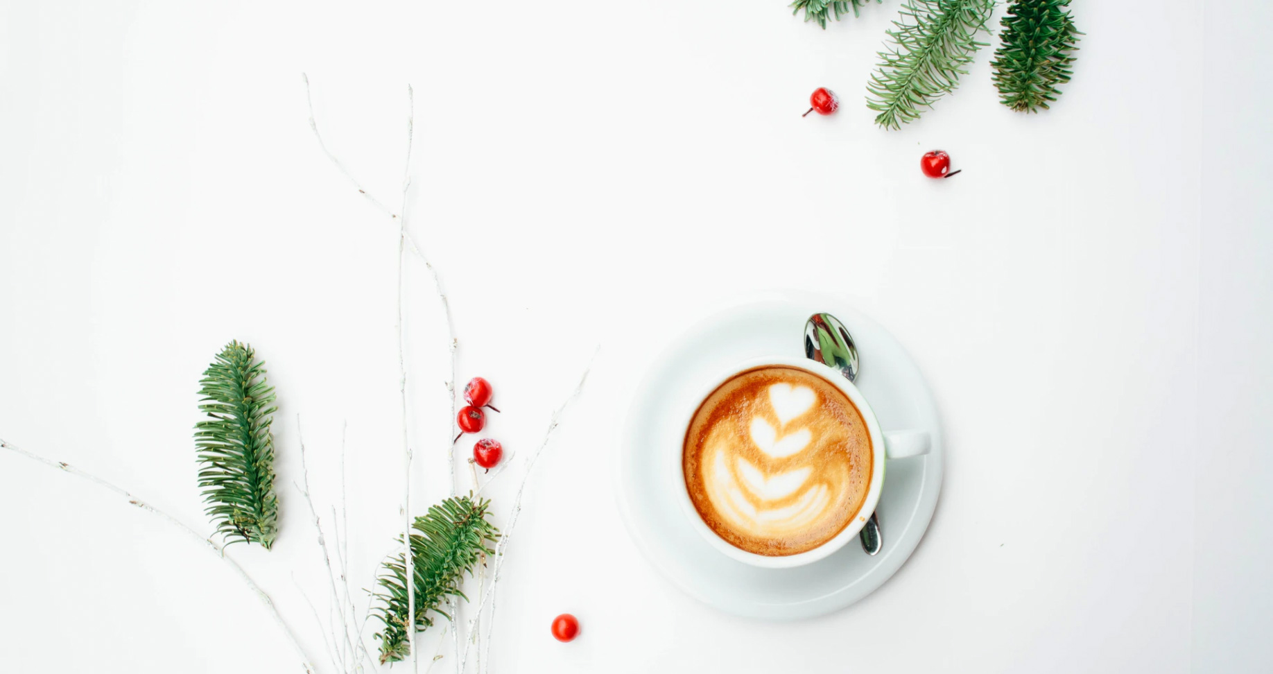 Cup of coffee and holiday decorations. unsplash - Toa Heftiba
