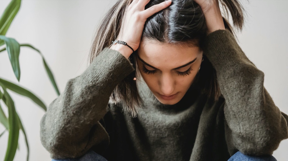 Woman stressed in thoughts.