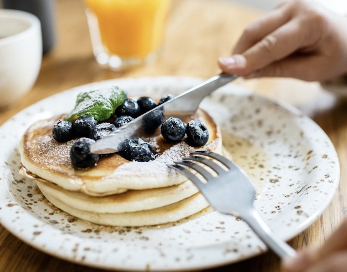 Cutting into pancakes for breakfast