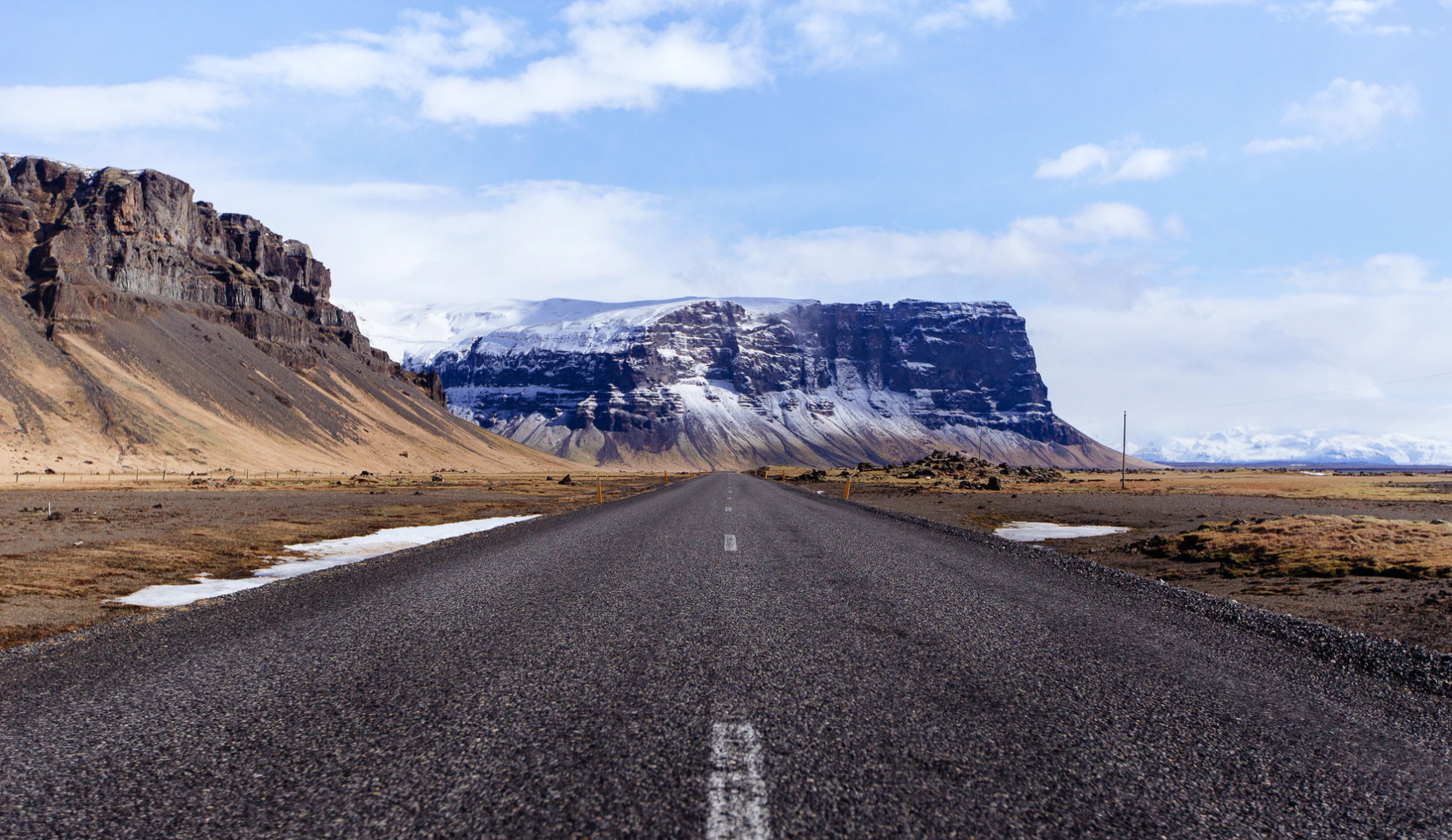 Road trip with mountains. Unsplash - Anders Jilden