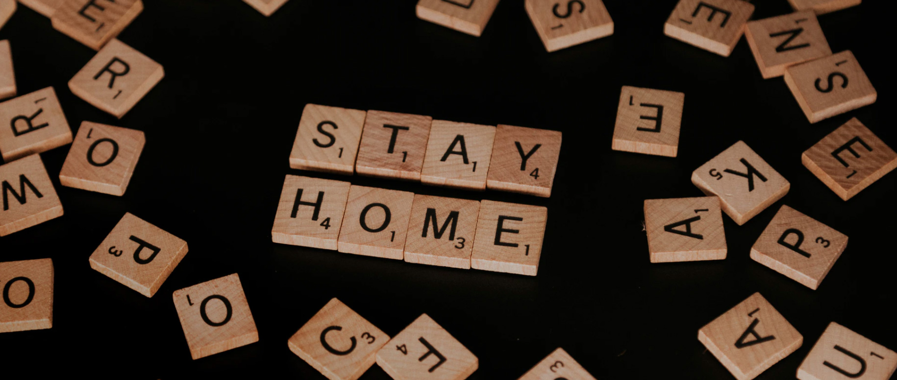 Stay home written out in tiles Unsplash - Priscilla Du Preez