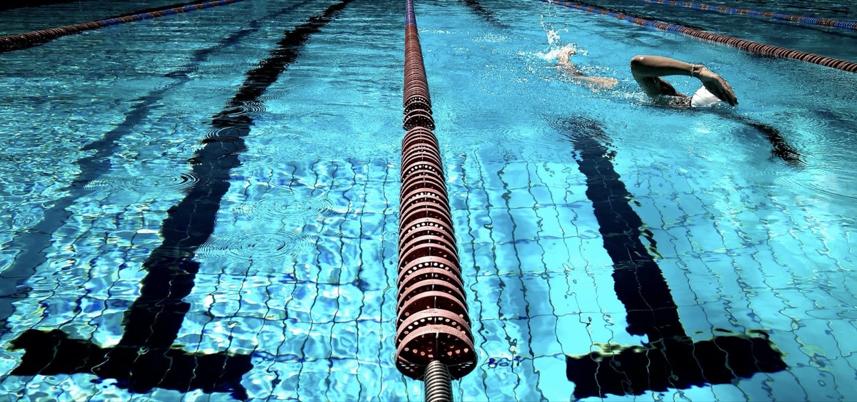 Person swimming in pool 