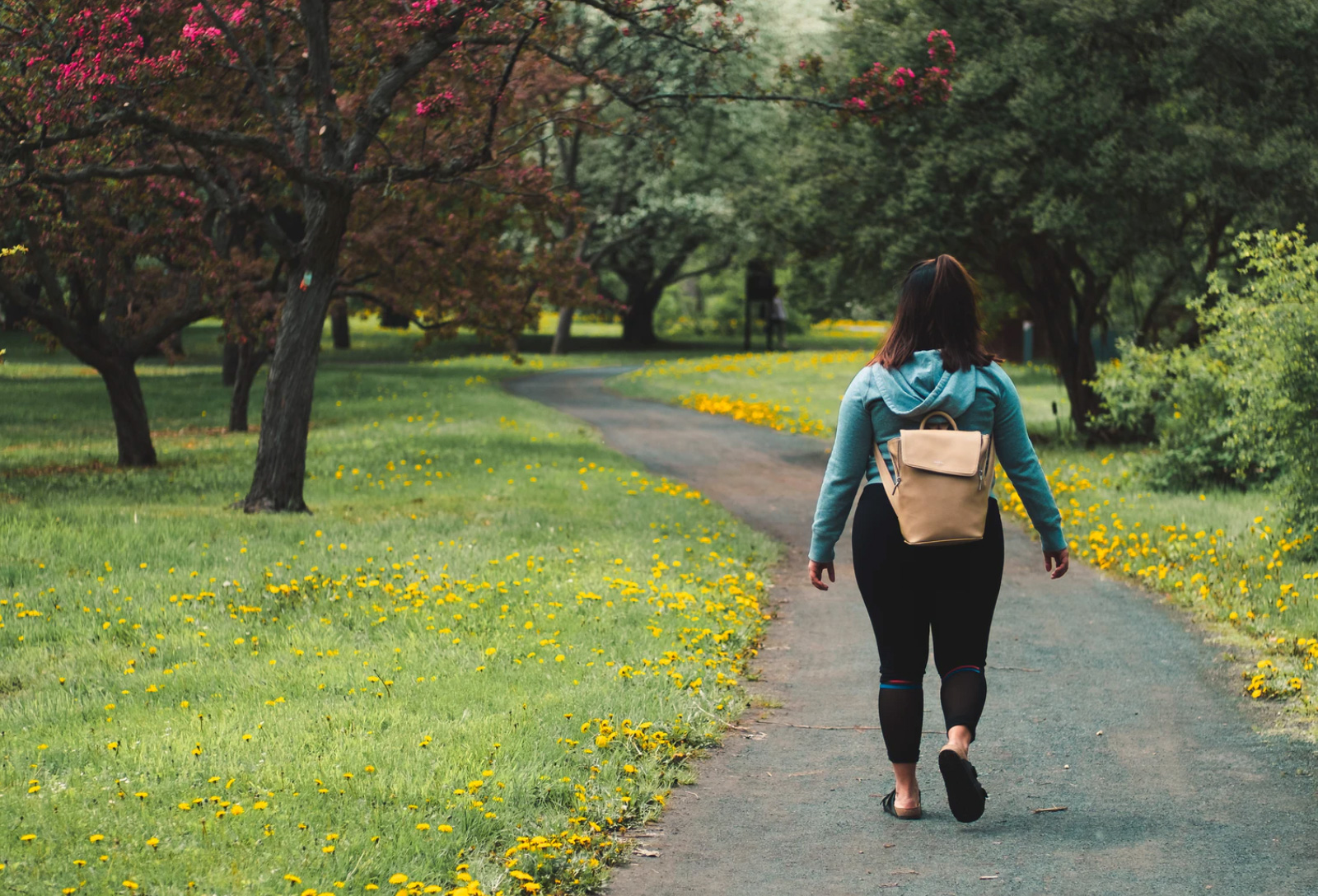 Woman walking outside in park